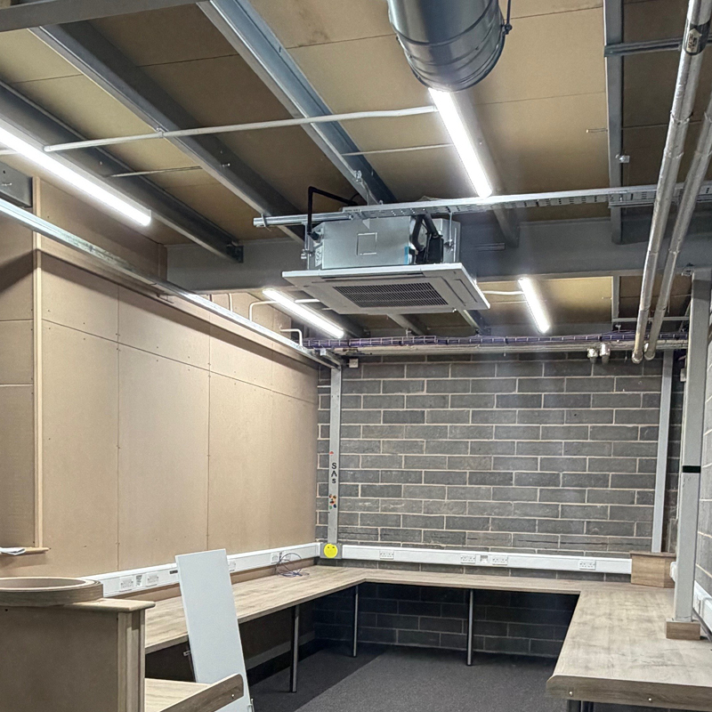 An air conditioning unit and ductwork being installed by Watsons Building Services