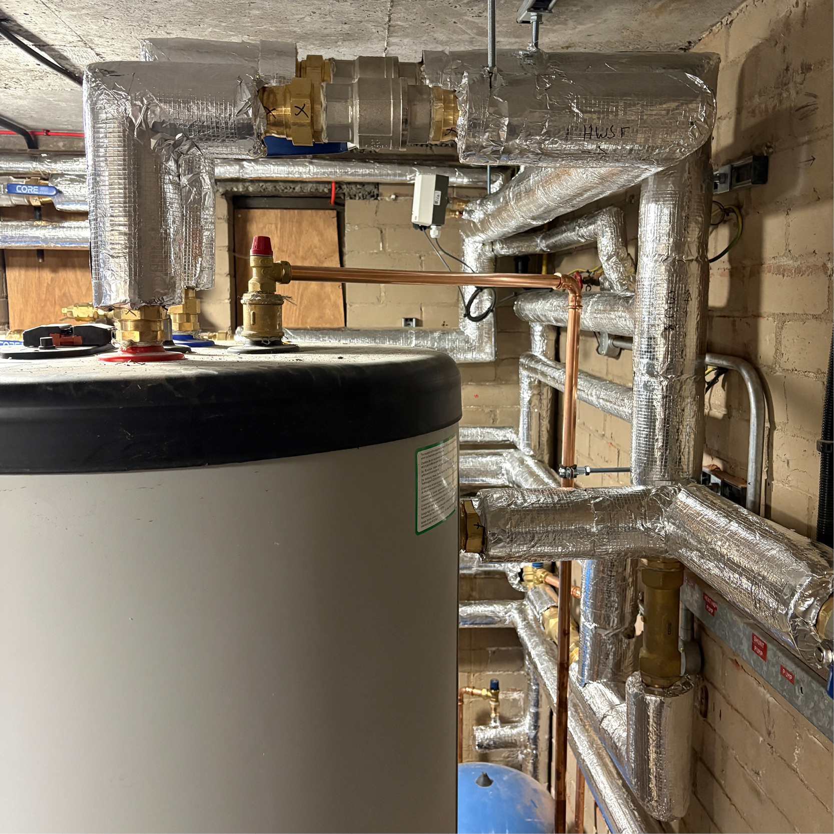 Watsons upgraded a gravity-fed system to a modern pressurised hot water solution, improving efficiency, reliability, and performance with minimal disruption.